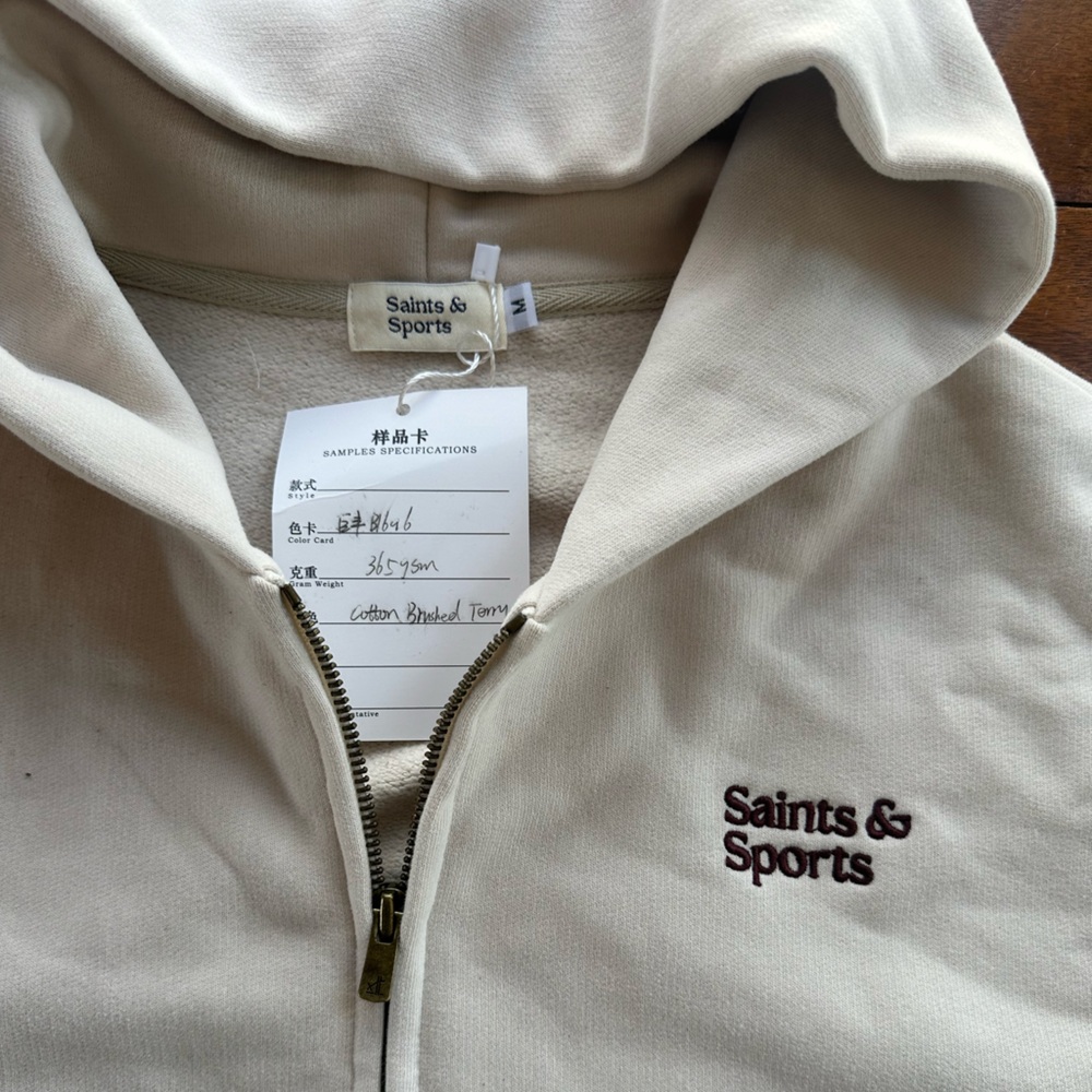 Saints & Sports Sample Zip Luxury Athleisure Hoodie Cream Embroidered Logo | Med